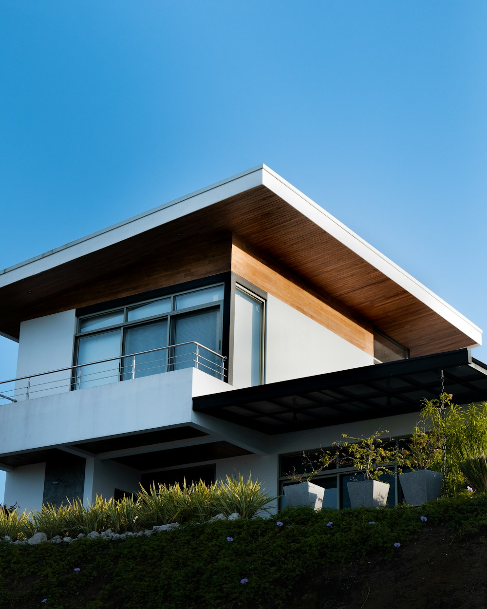 a house with a balcony and a balcony railing