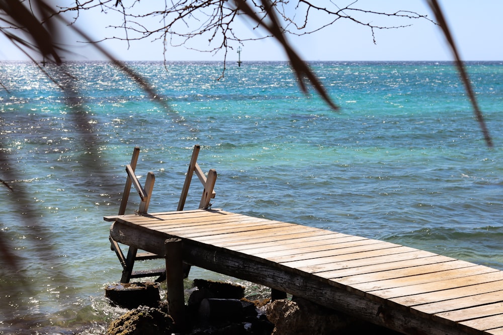 a wooden dock sitting on top of a body of water