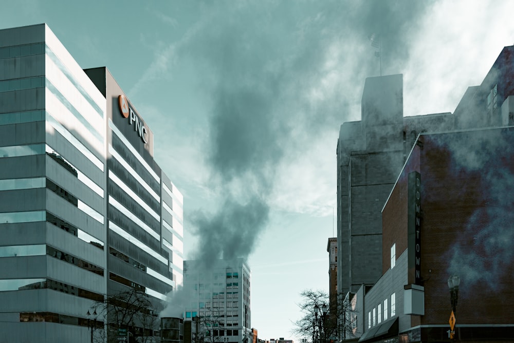 smoke billows from a building in a city