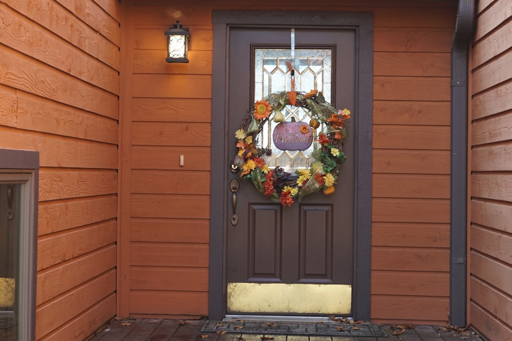 a front door with a wreath on it