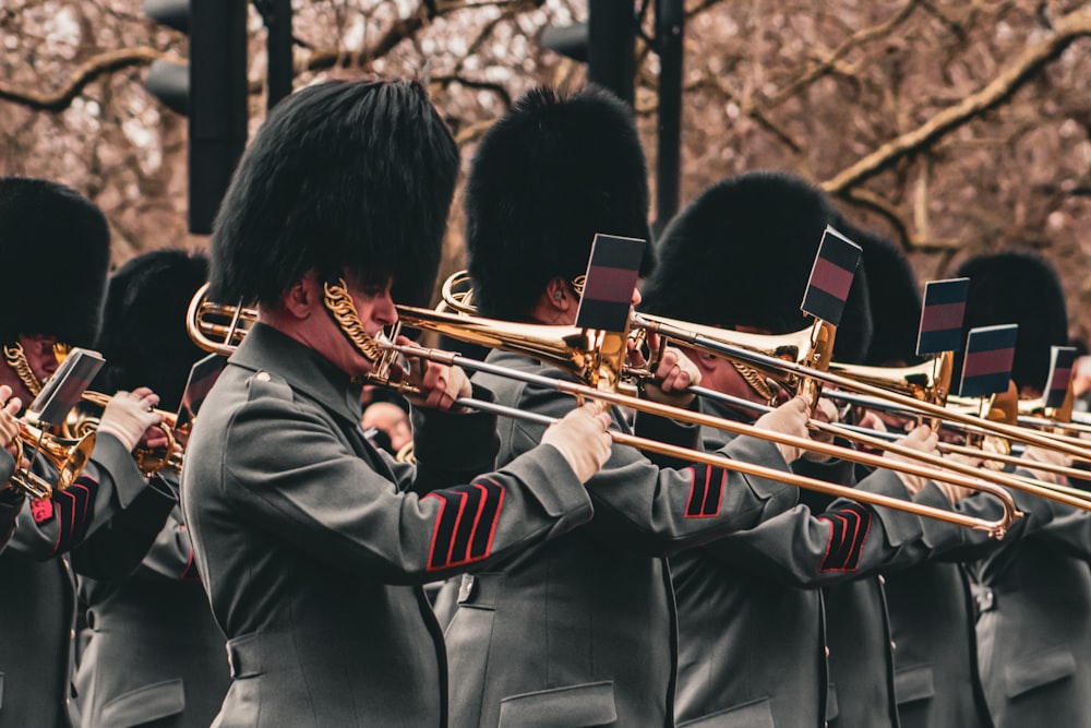 a group of men in uniform playing musical instruments