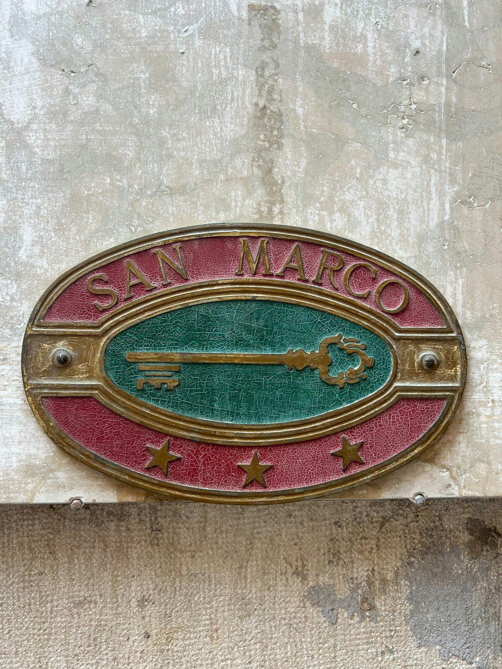 a sign on the side of a building that says san marco