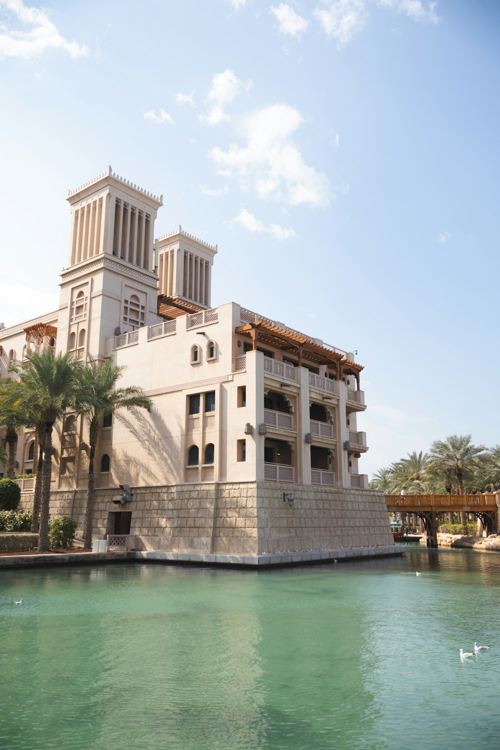 a large building sitting on the side of a body of water