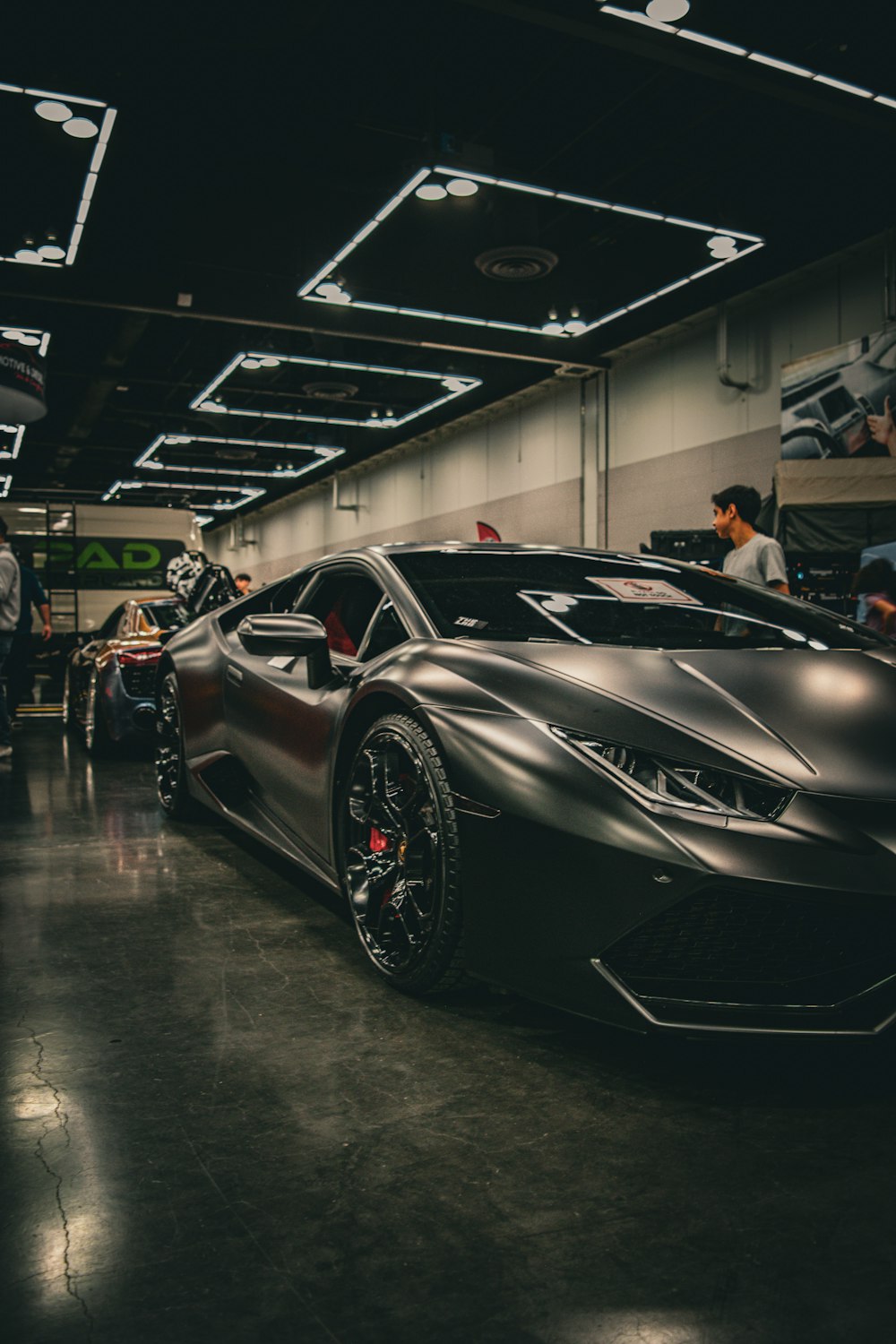 a black sports car parked in a garage