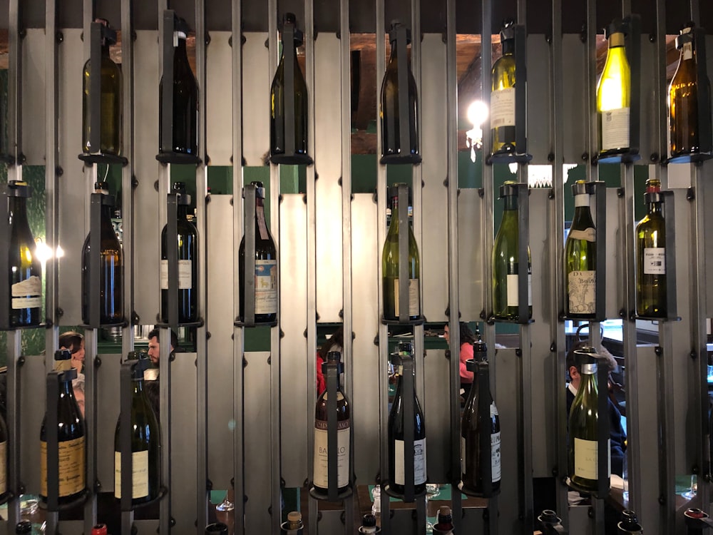 a bunch of bottles of wine in a room