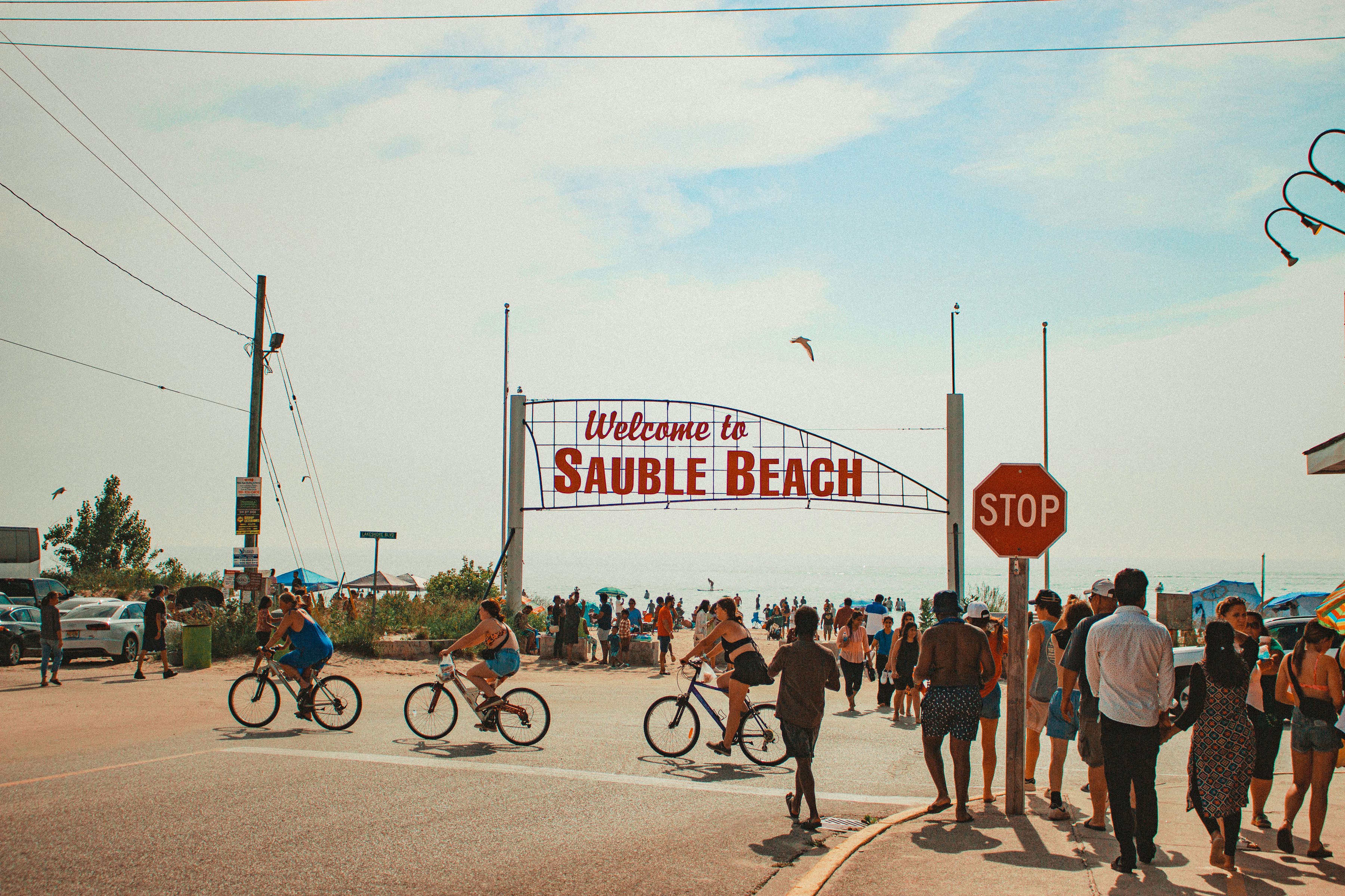 a group of people riding bikes down a street