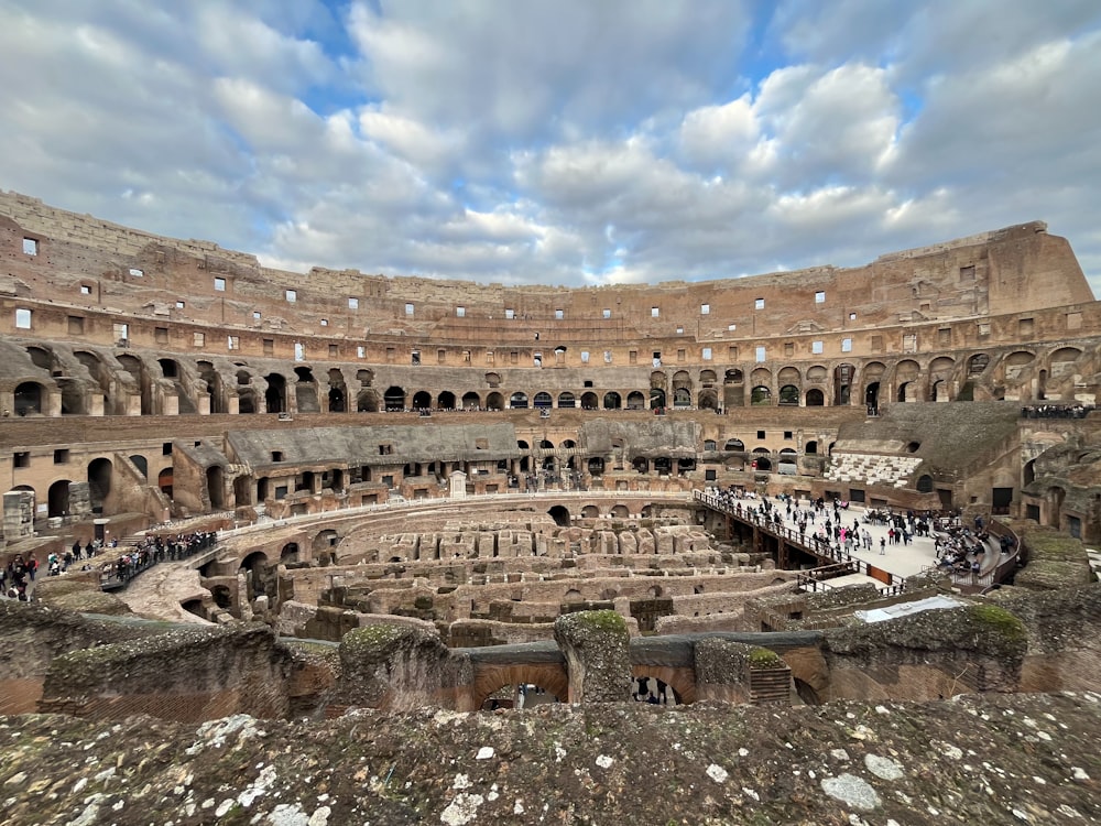 a group of people standing inside of a large building