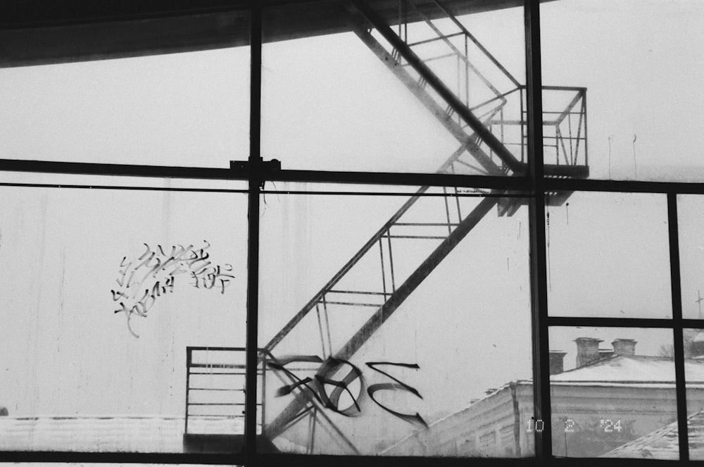 a black and white photo of a fire escape