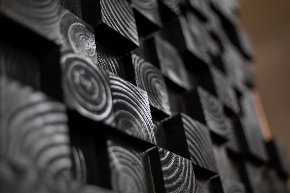 a close up of a wall made of black and white squares