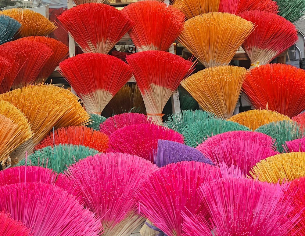 a large assortment of colorful brushes for sale