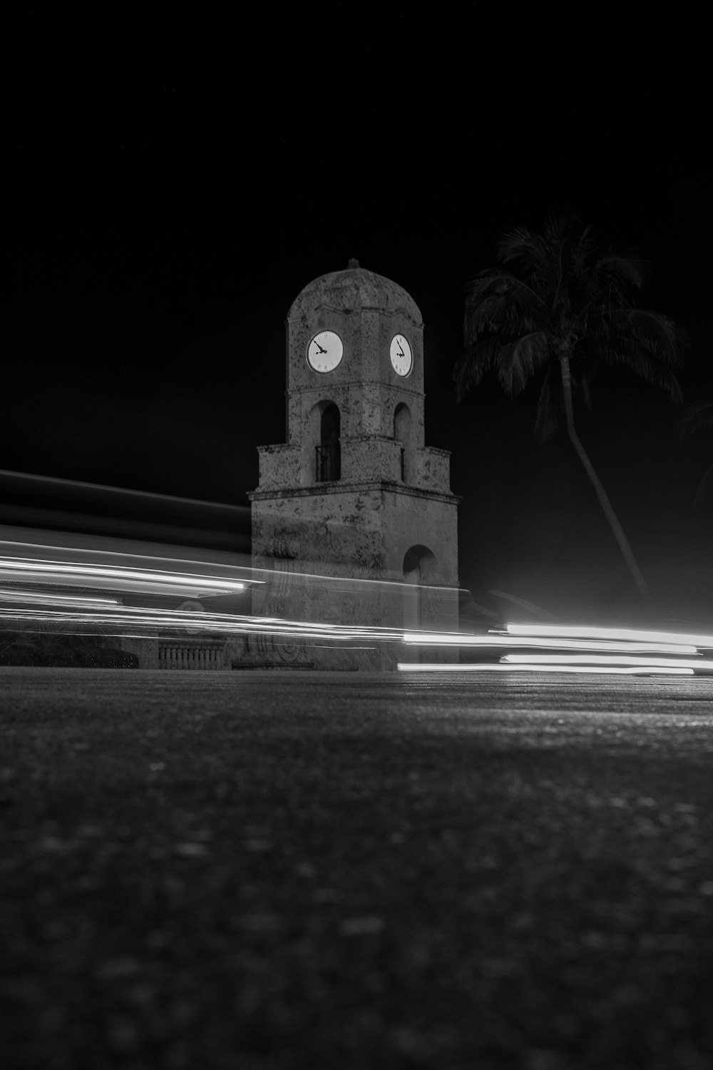 a black and white photo of a clock tower