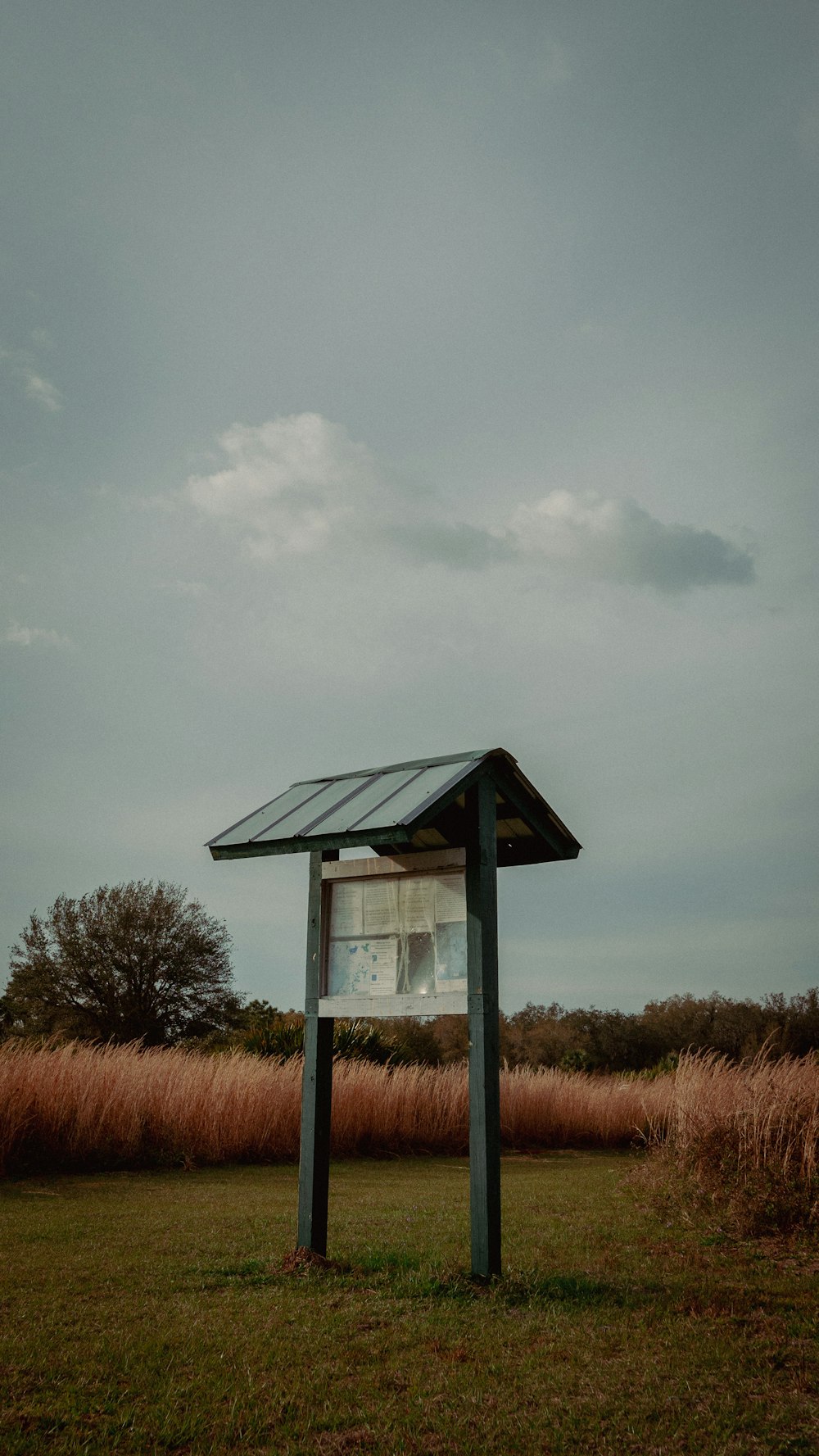 a wooden structure with a solar panel on top of it