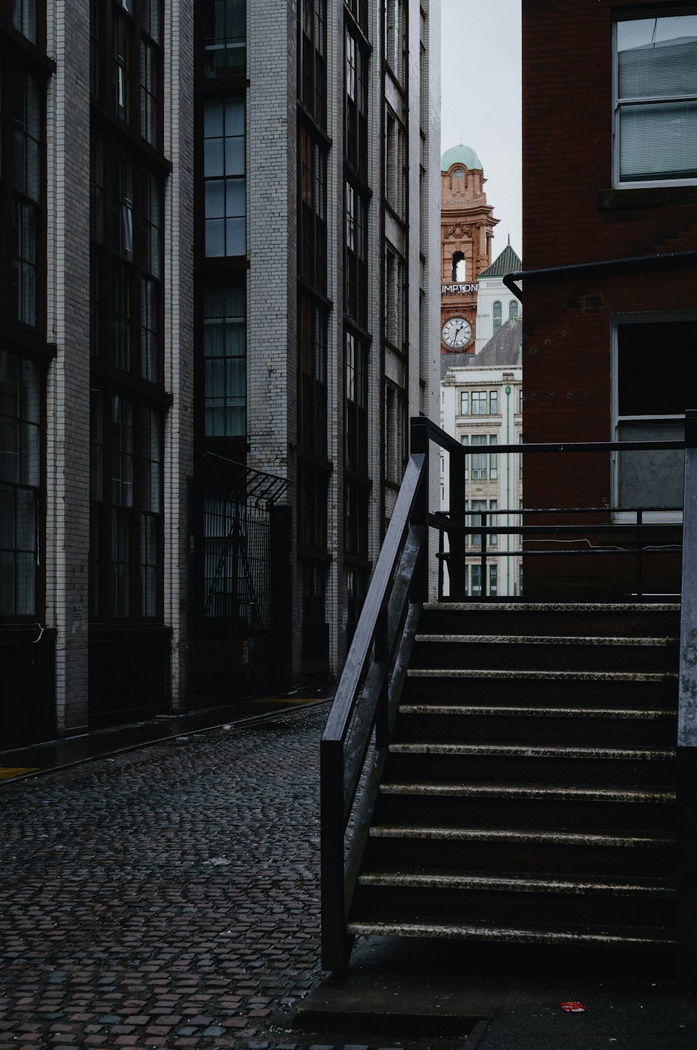 a building with a clock tower in the background