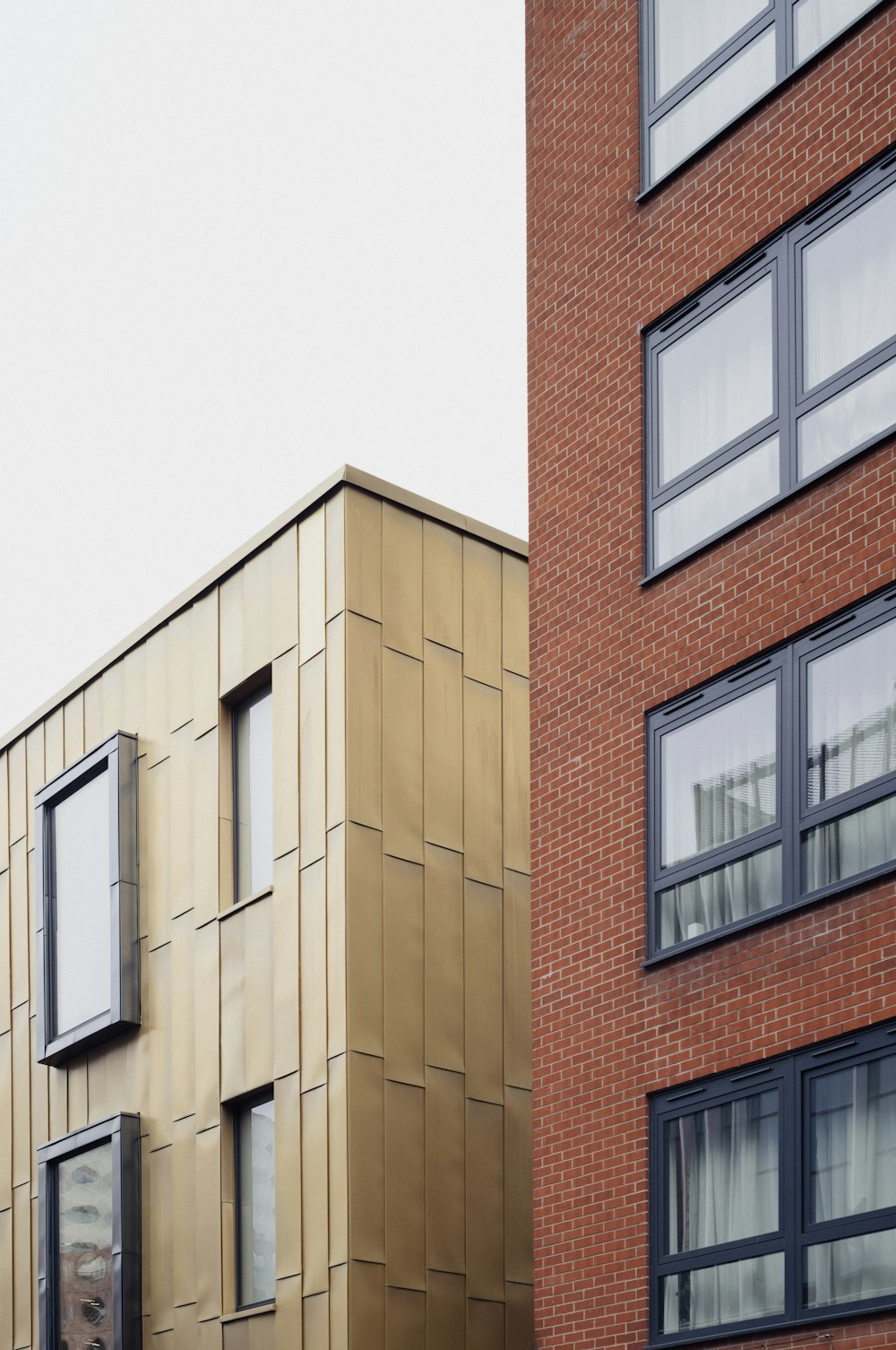 a tall brick building next to a tall brick building