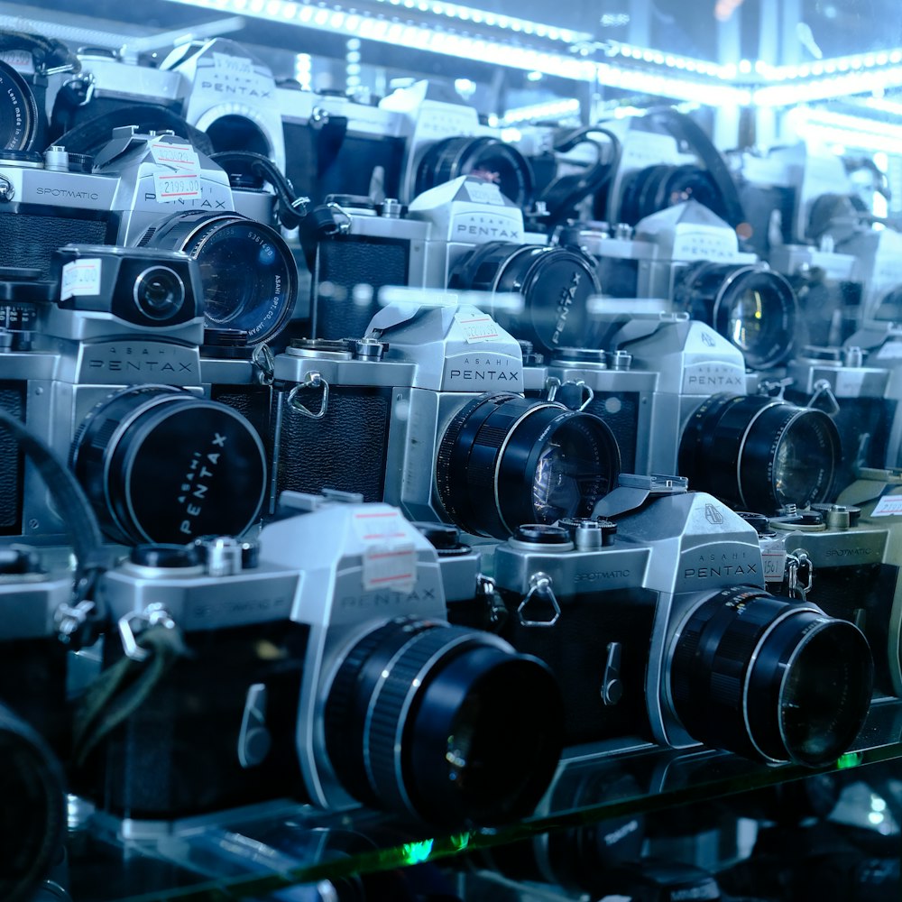 a room filled with lots of different types of cameras