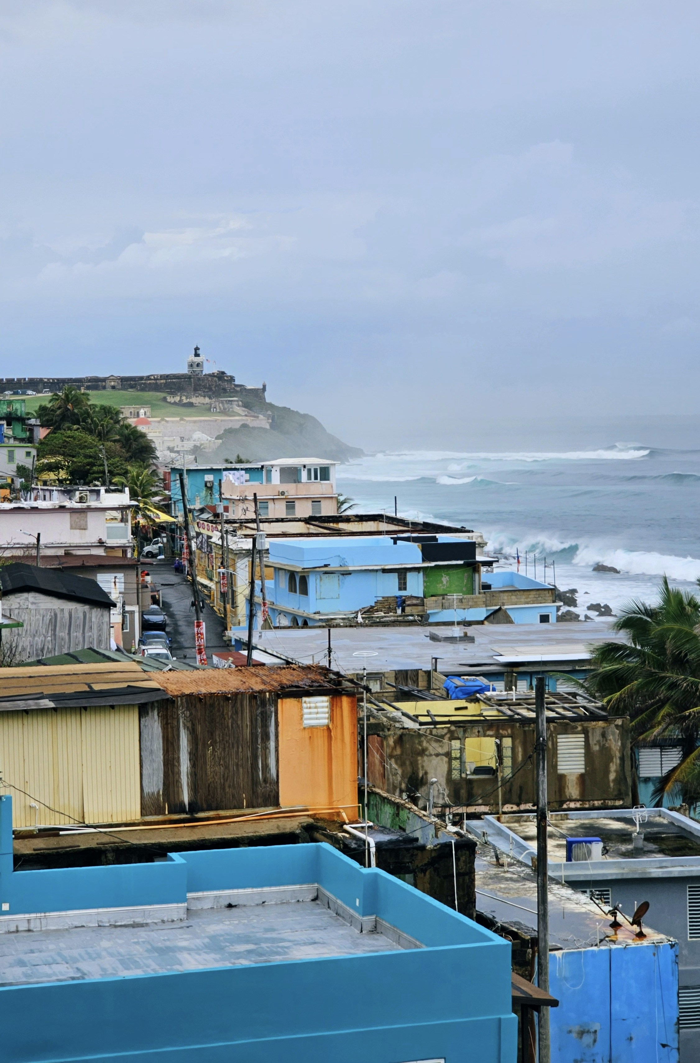 a group of houses next to a body of water