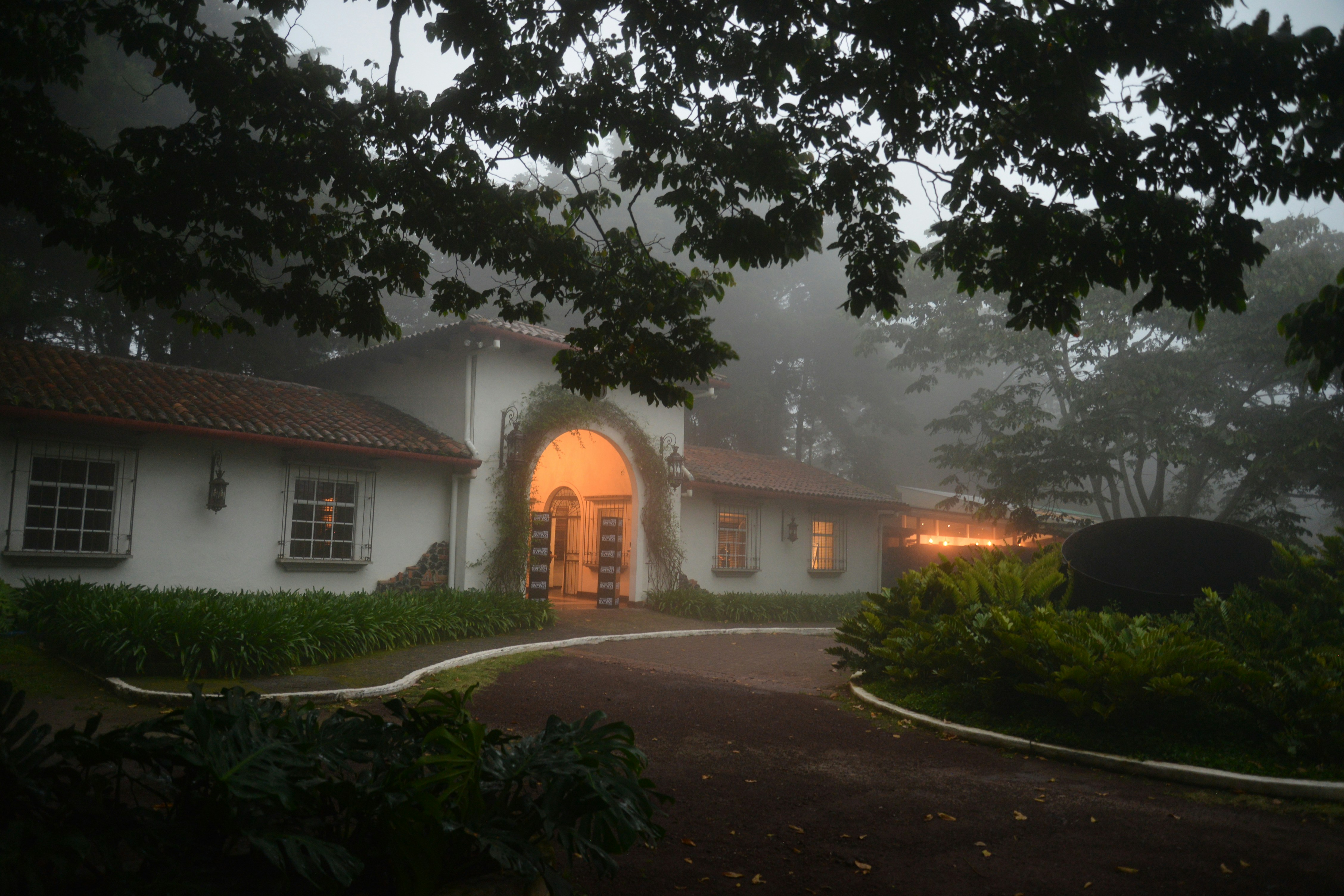 Mountain house with fog and beautiful lighting at night