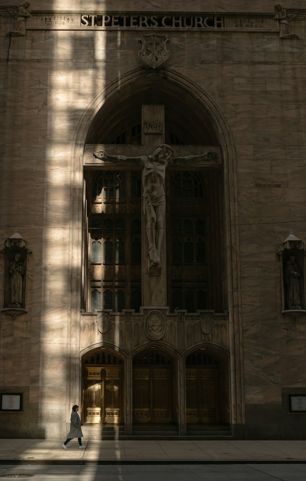 a person walking in front of a church