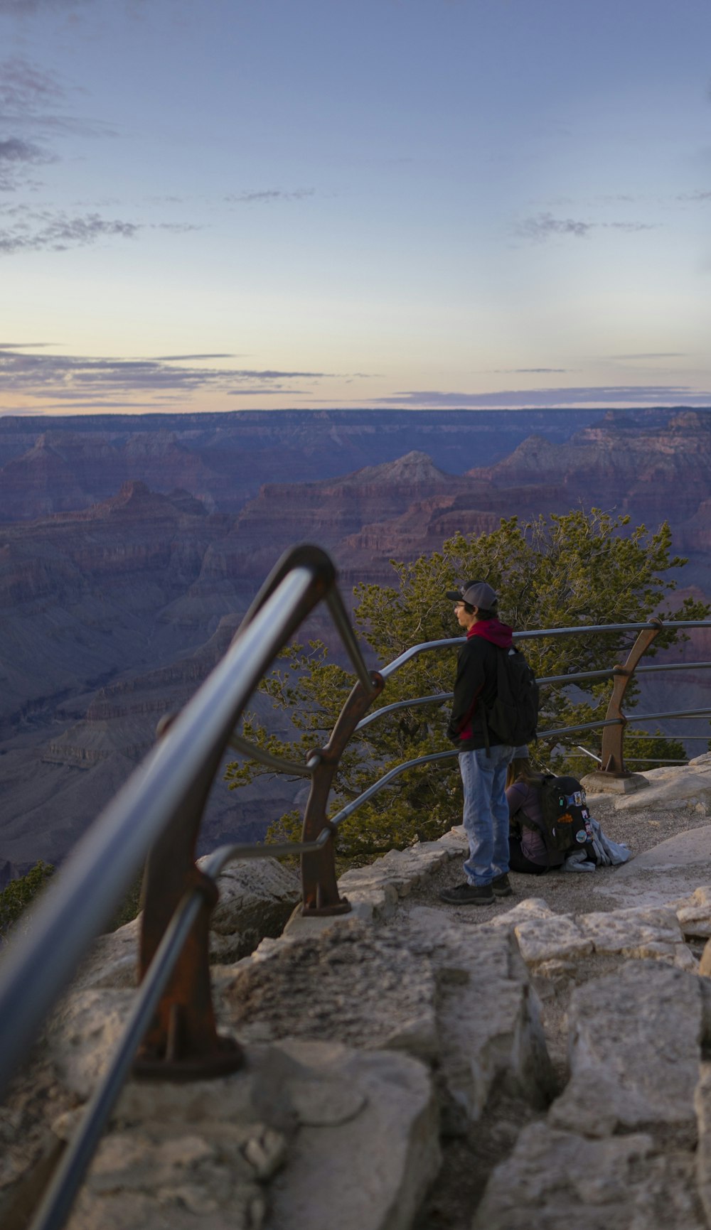 a man standing at the edge of a cliff