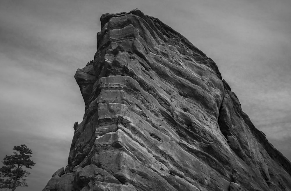 a black and white photo of a rock formation