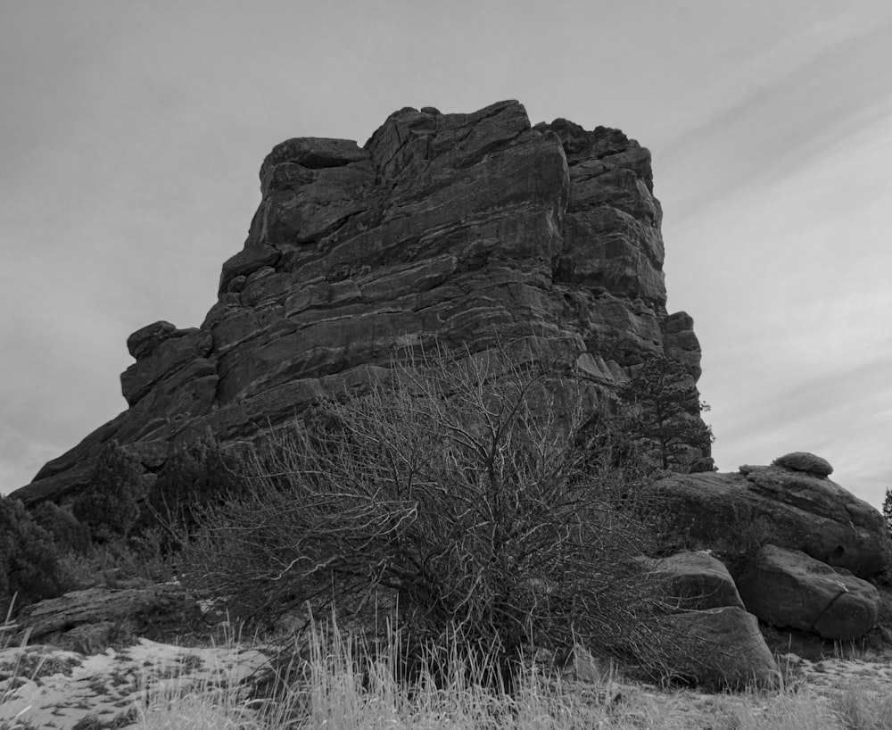 a black and white photo of a rock formation