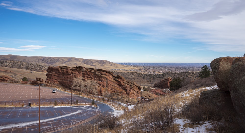 a scenic view of a road in the mountains