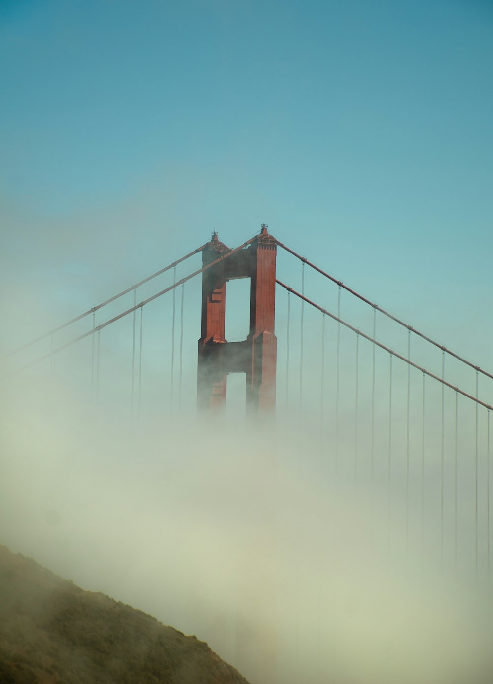 a foggy view of the golden gate bridge