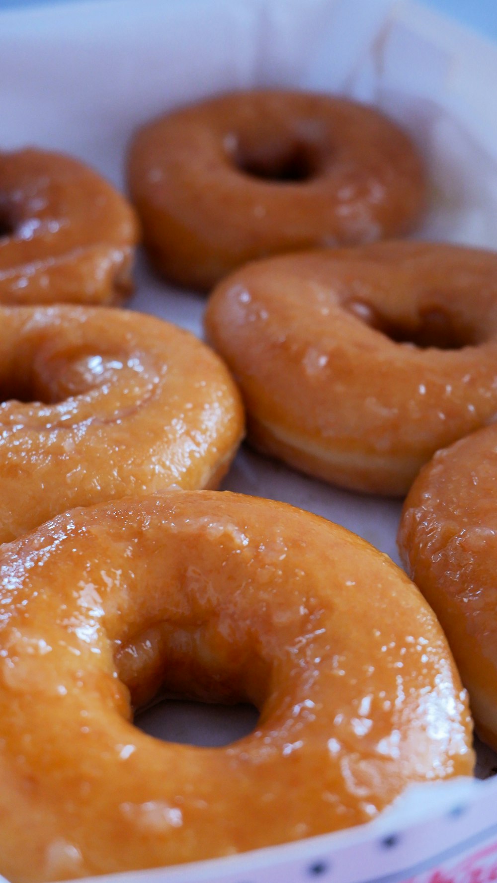 a close up of a box of doughnuts