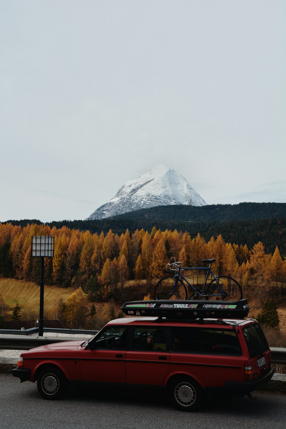 a red car parked on the side of the road