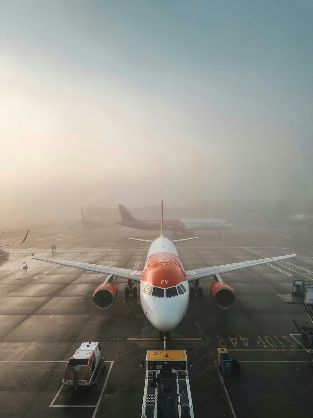 a large jetliner sitting on top of an airport tarmac