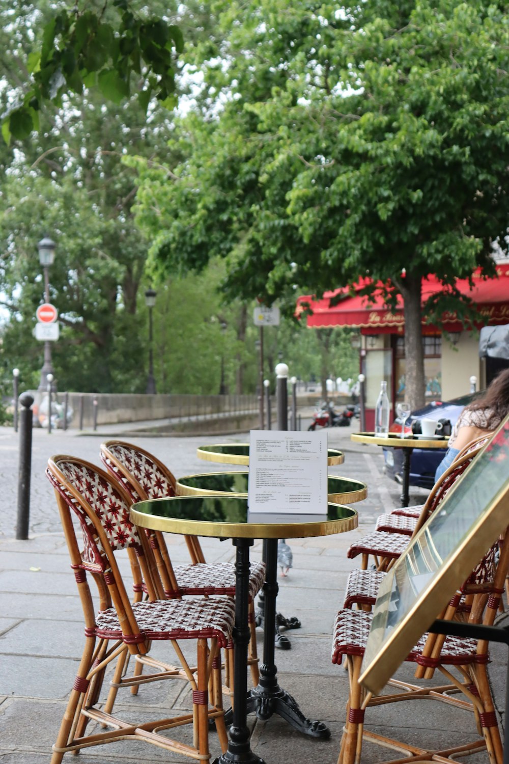 a person sitting at a table with a menu on it