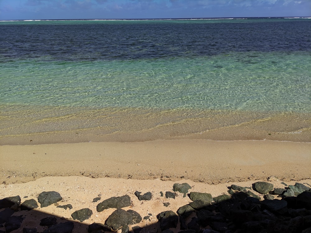 a view of the ocean from the shore of a beach