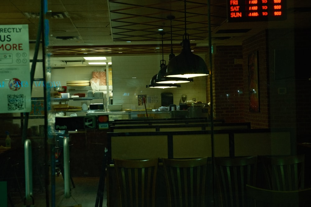 a restaurant with a clock and a sign on the wall