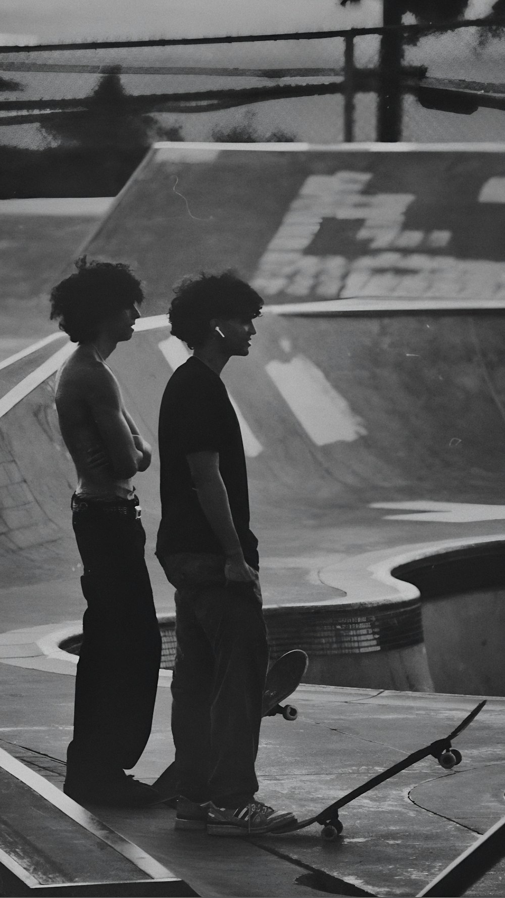 a couple of young men standing next to each other