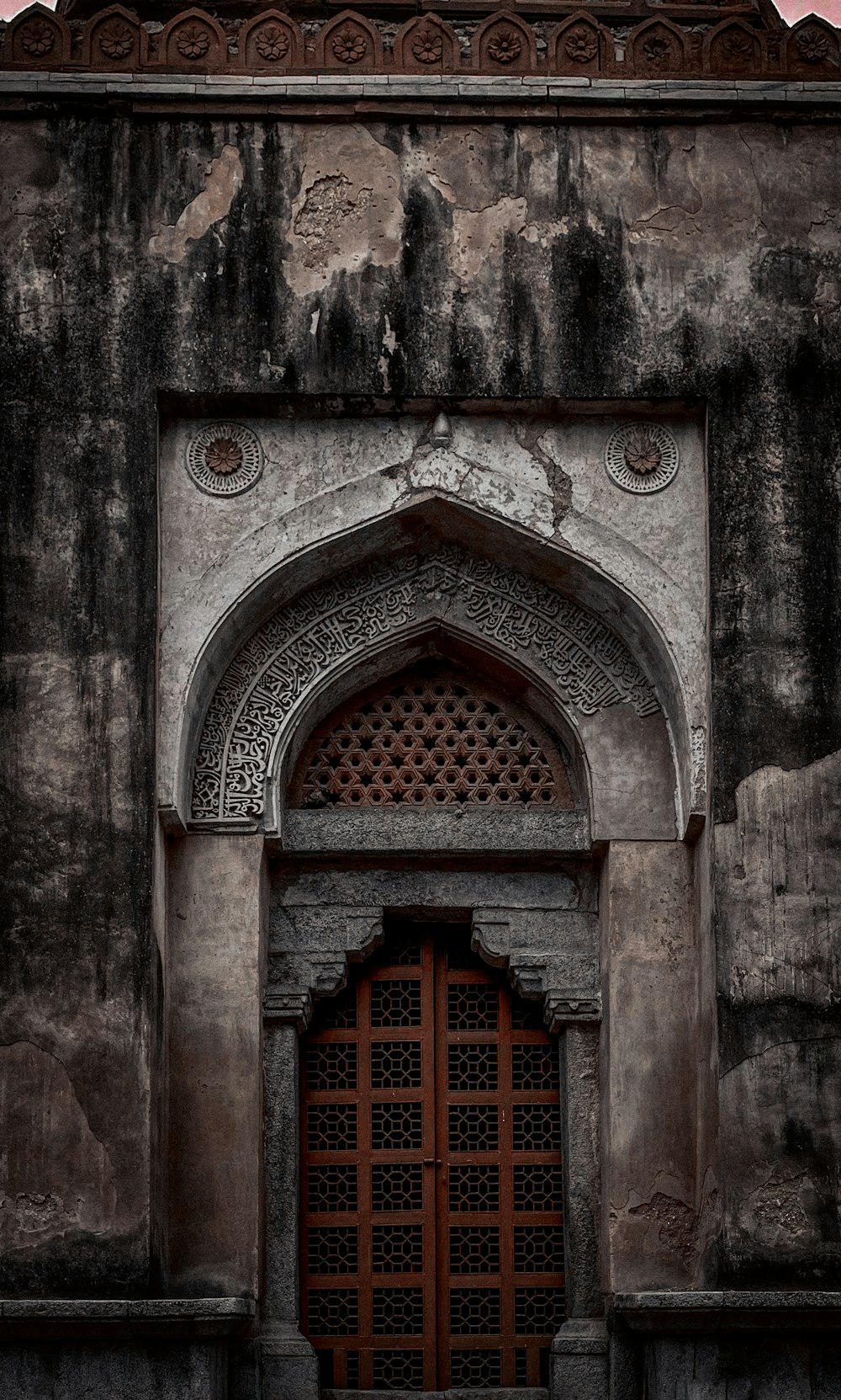 a very old building with a big wooden door