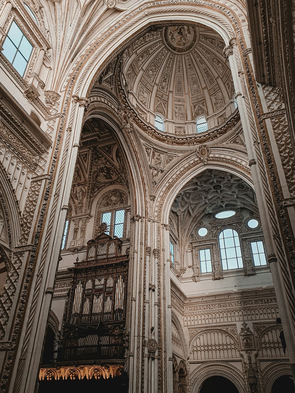 a large cathedral with a high ceiling and high windows