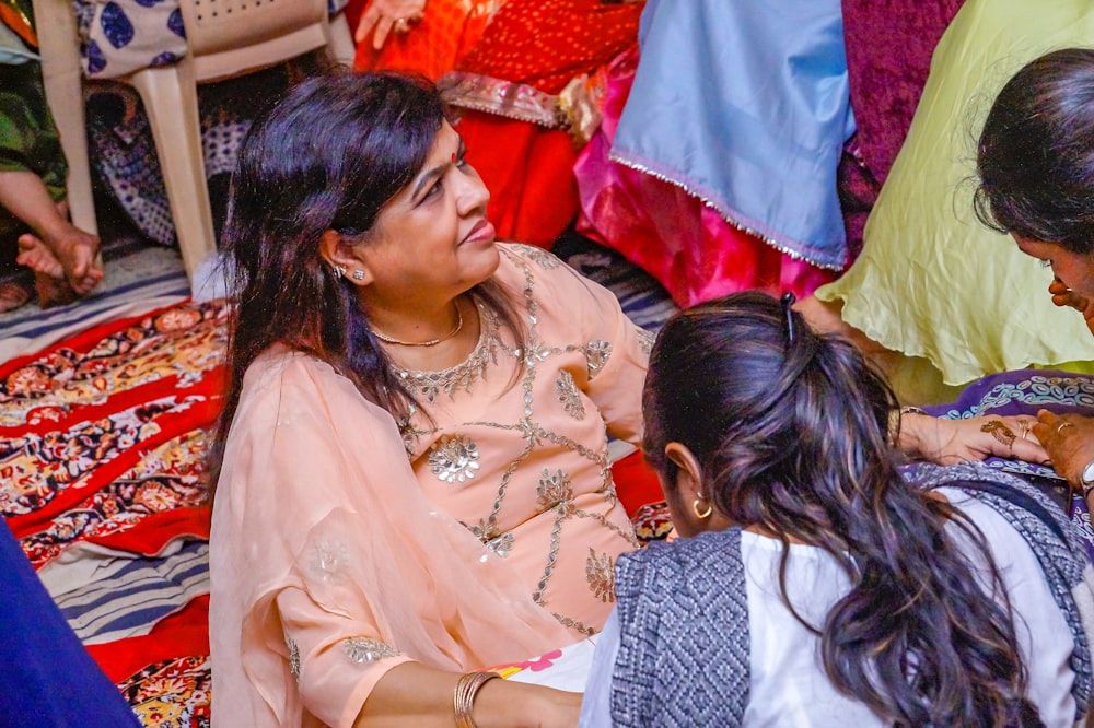 a group of women sitting next to each other