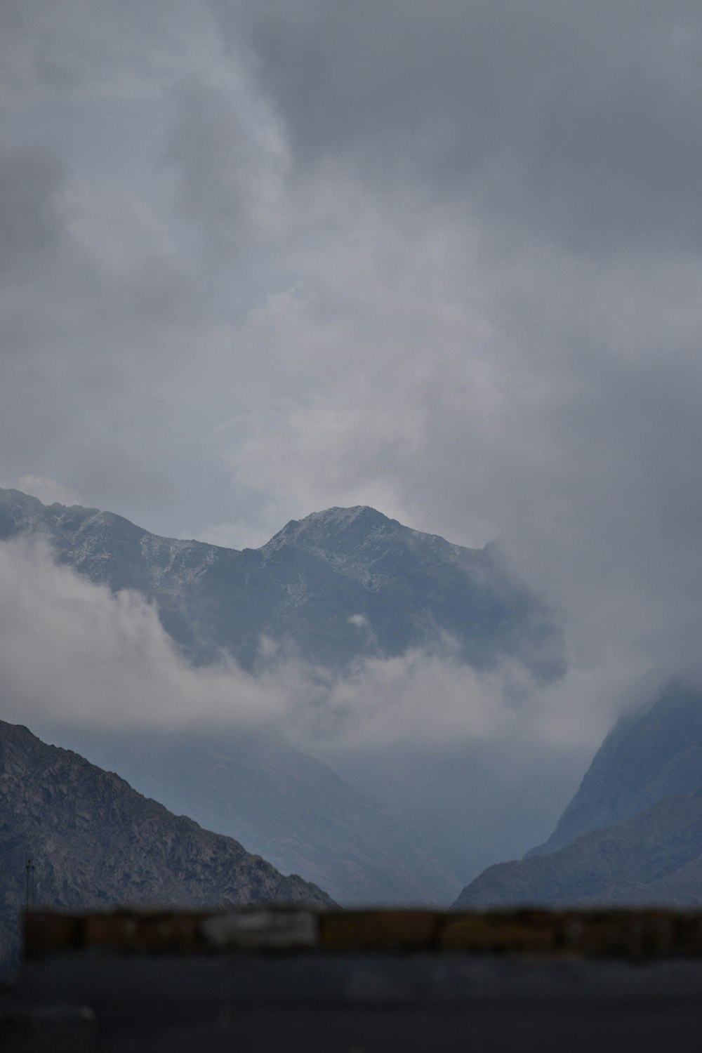a view of a mountain range with a cloudy sky