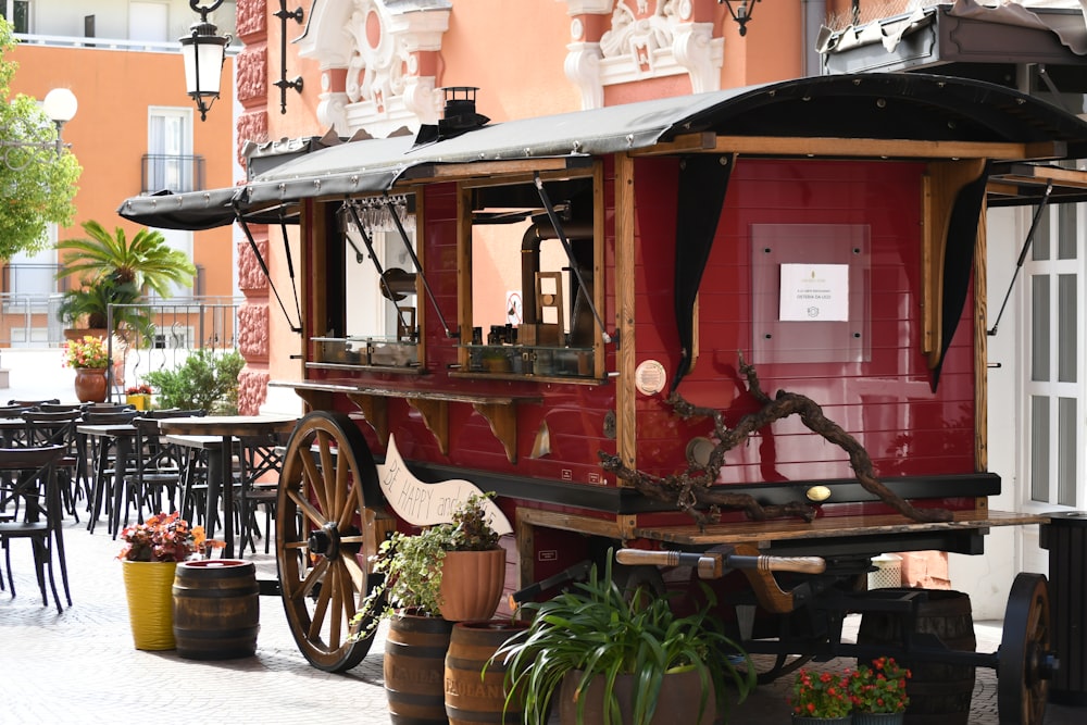 a horse drawn carriage parked in front of a building