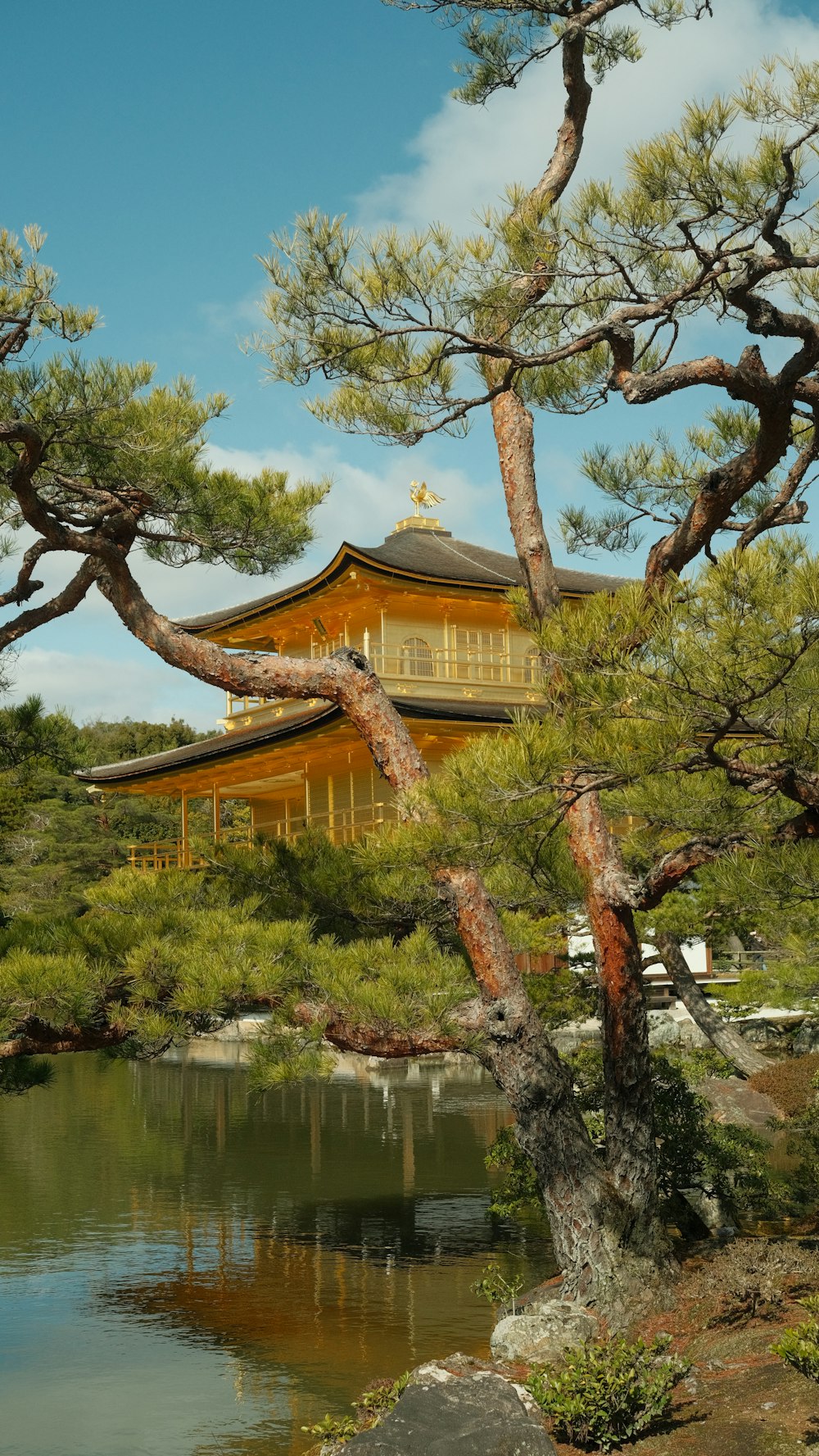 a large building sitting next to a body of water