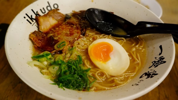 A bowl of ramen with an egg on top