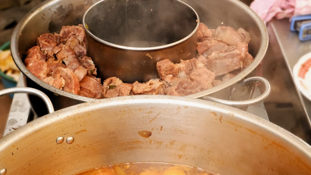 a large pot of food sitting on top of a stove