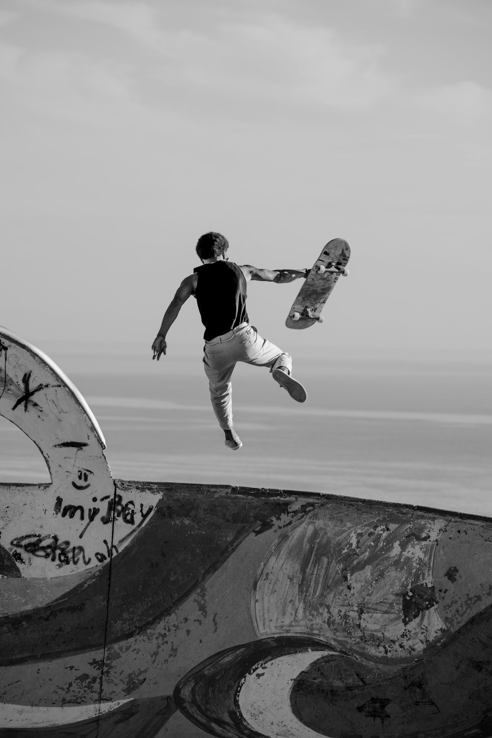 a man flying through the air while riding a skateboard