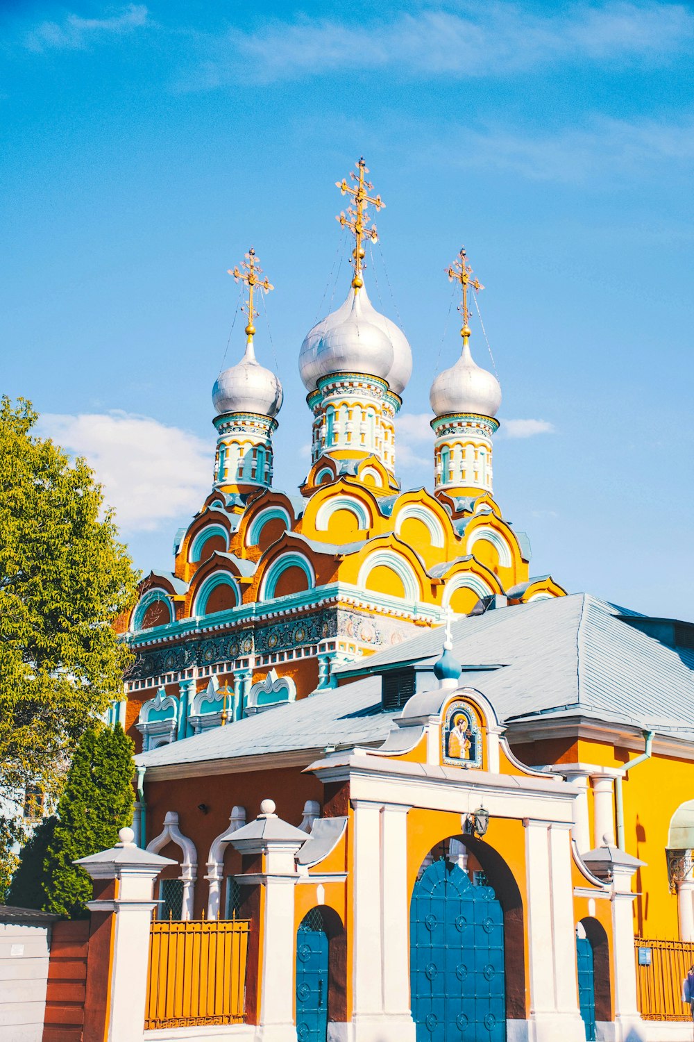 a yellow and blue building with two towers