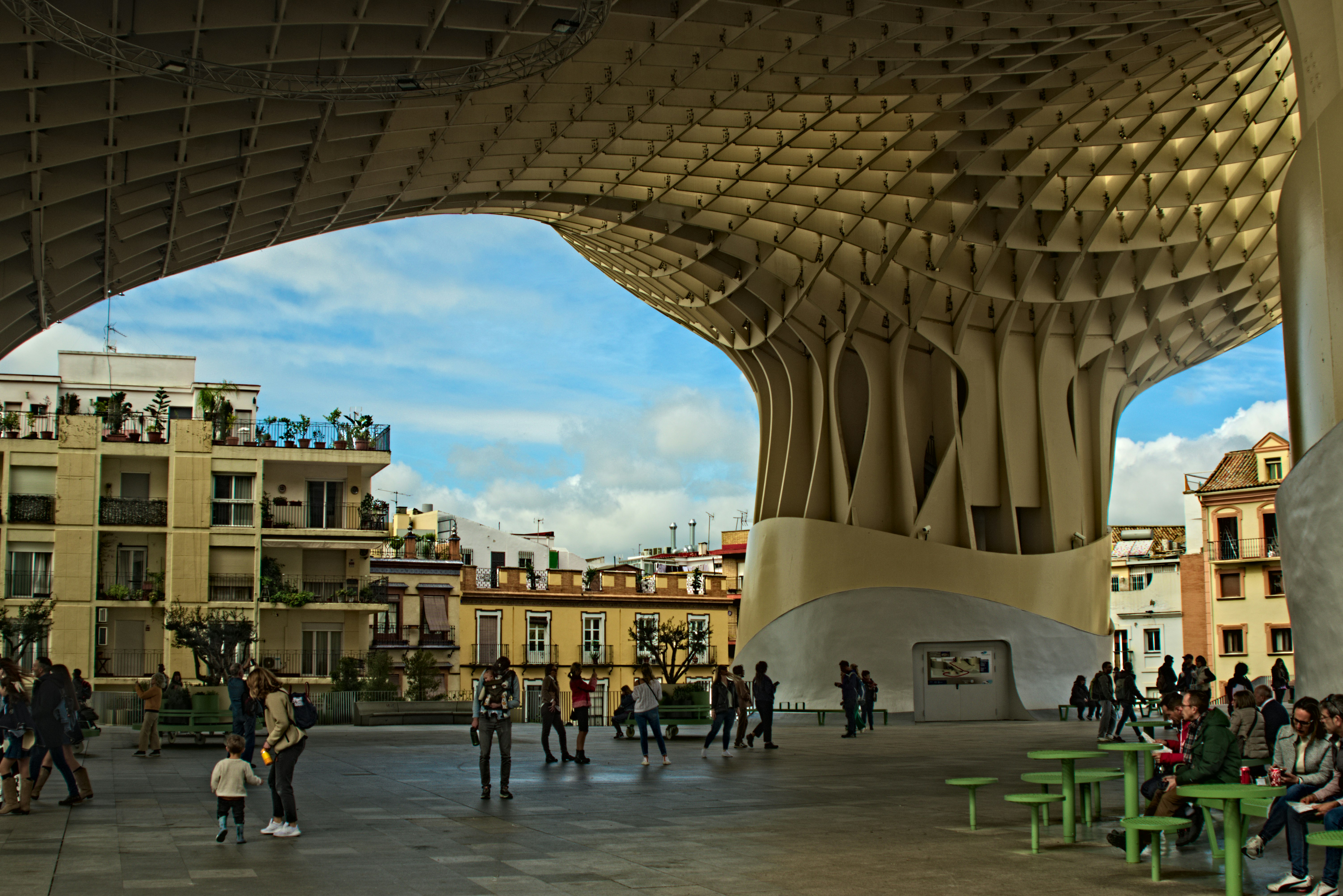 a group of people standing around a building