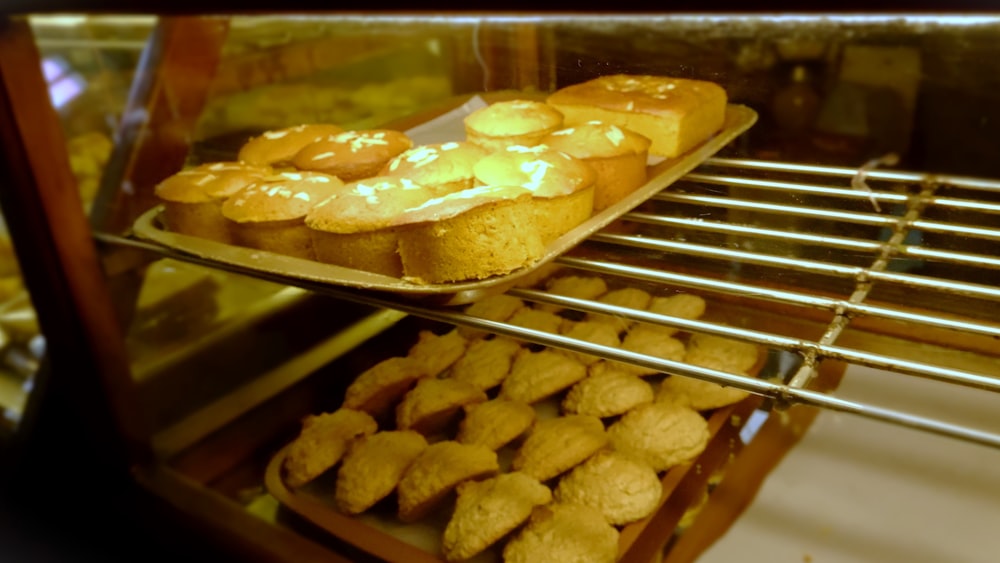 a display case filled with lots of pastries