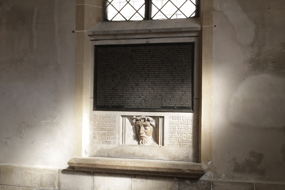 a bust of a man in a window of a building