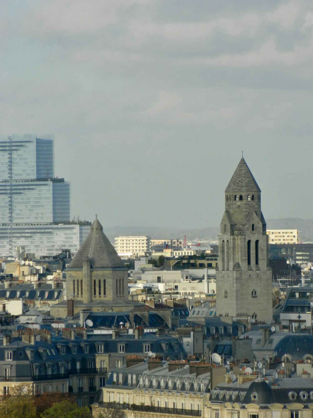 a view of a city with tall buildings and a clock tower