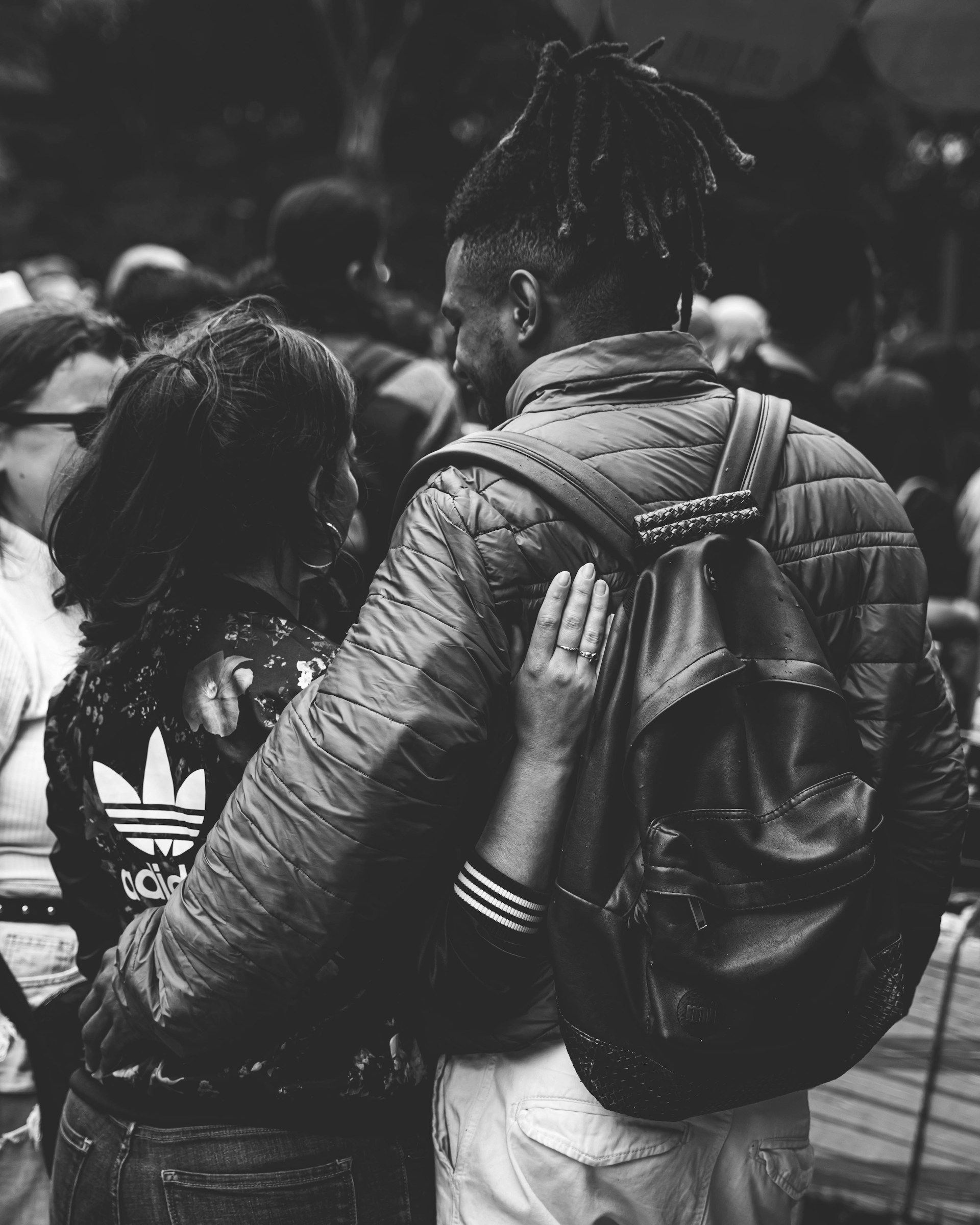 a black and white photo of a man and a woman