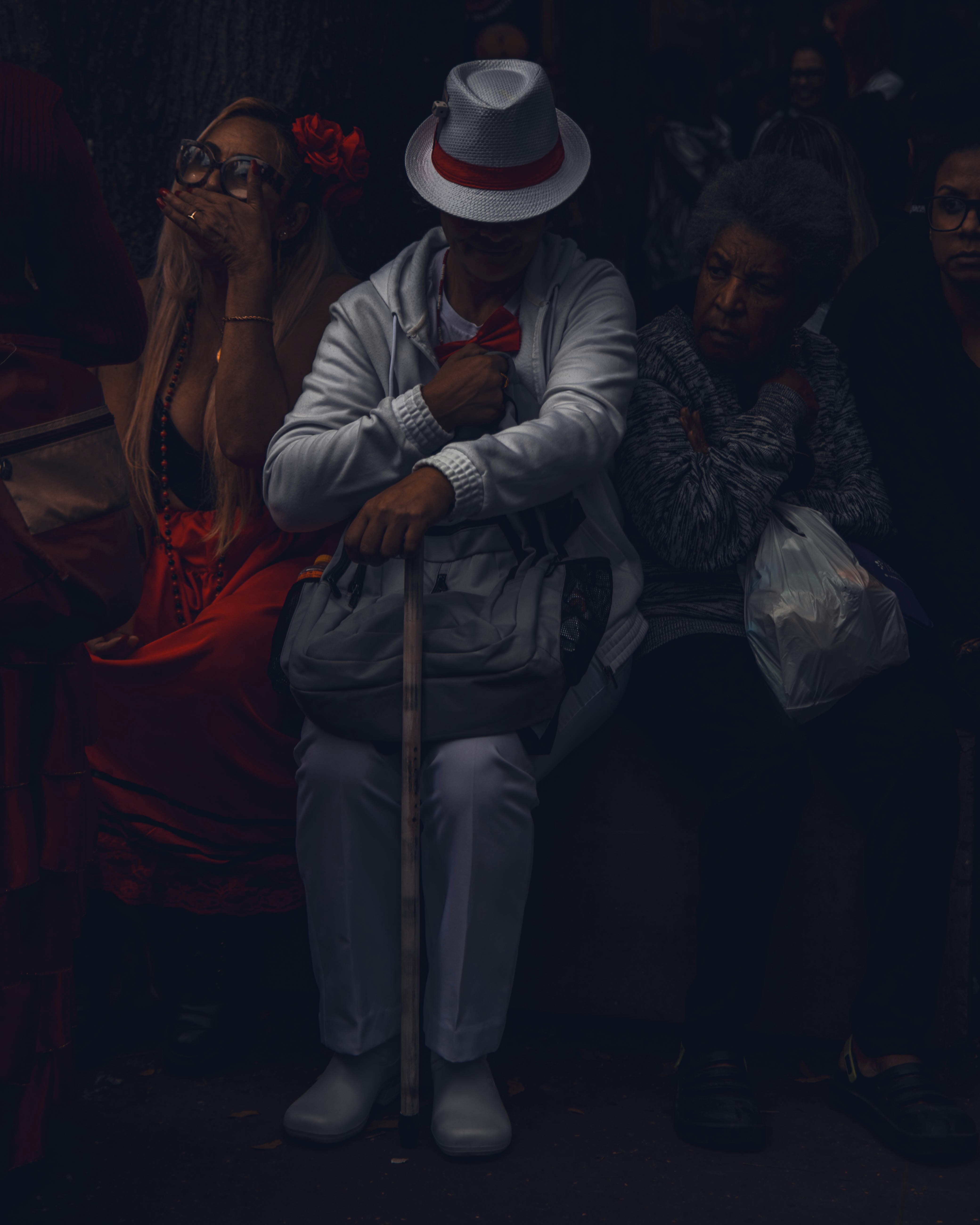 A man sitting on a bench with a cane photo – Free Street photography ...